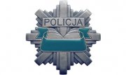 Zdjęcie przedstawia policyjną odznakę.